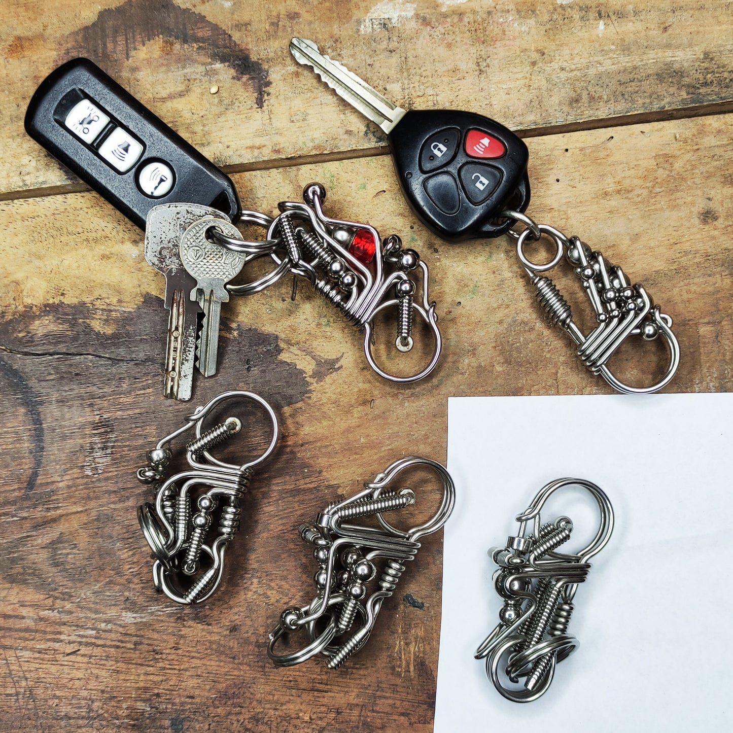 Handmade camping and motorbike keychains as gifts for boyfriends going hiking, camping, or outdoor activities